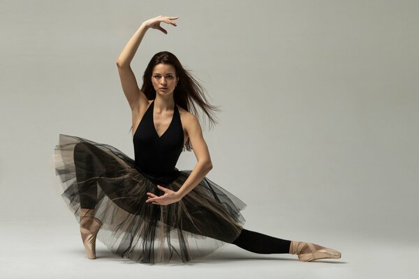 Flexible ballerina in a black tutu