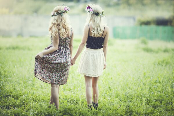 Two beauties in dresses in nature