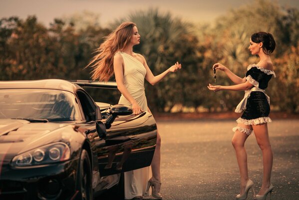 Girls on the highway at a chic car