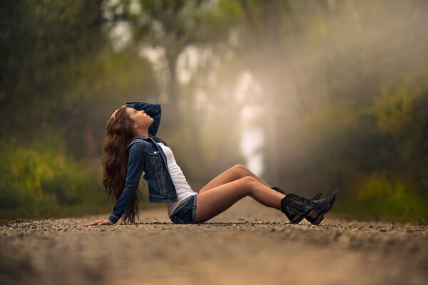 Long-haired girl by the road