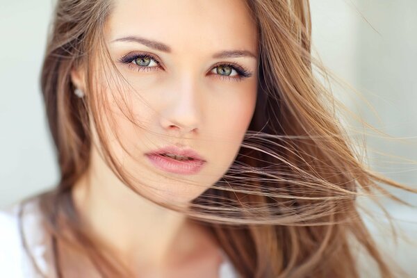 The look of a thoughtful girl with long hair