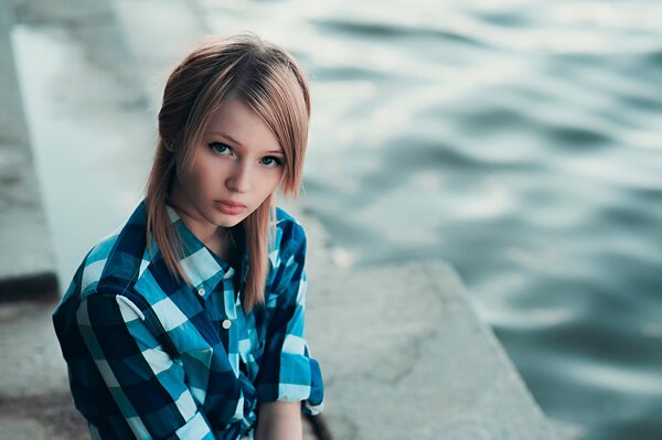 Emily Browning in a plaid shirt