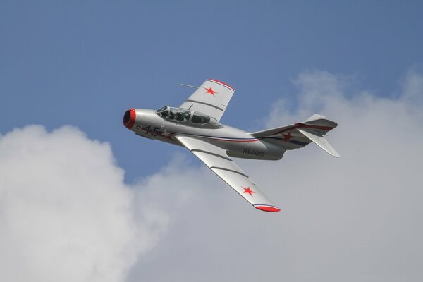 The fighter hovers over the debris