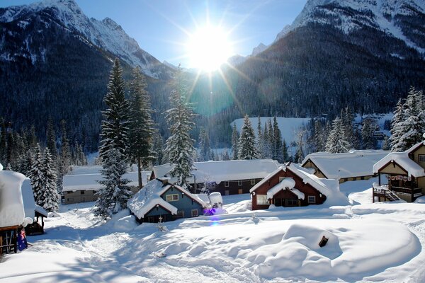 Bright sunrise in snowy mountains