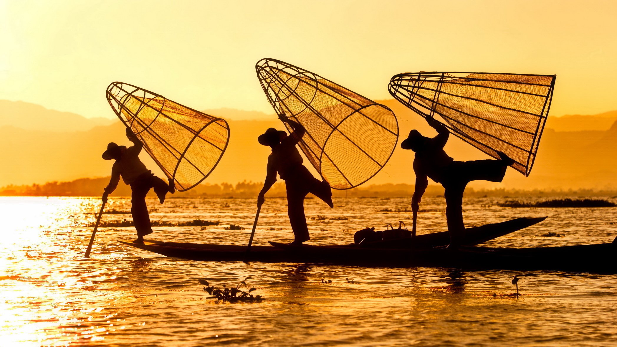 river boat fishermen trap silhouettes morning sunrise sun