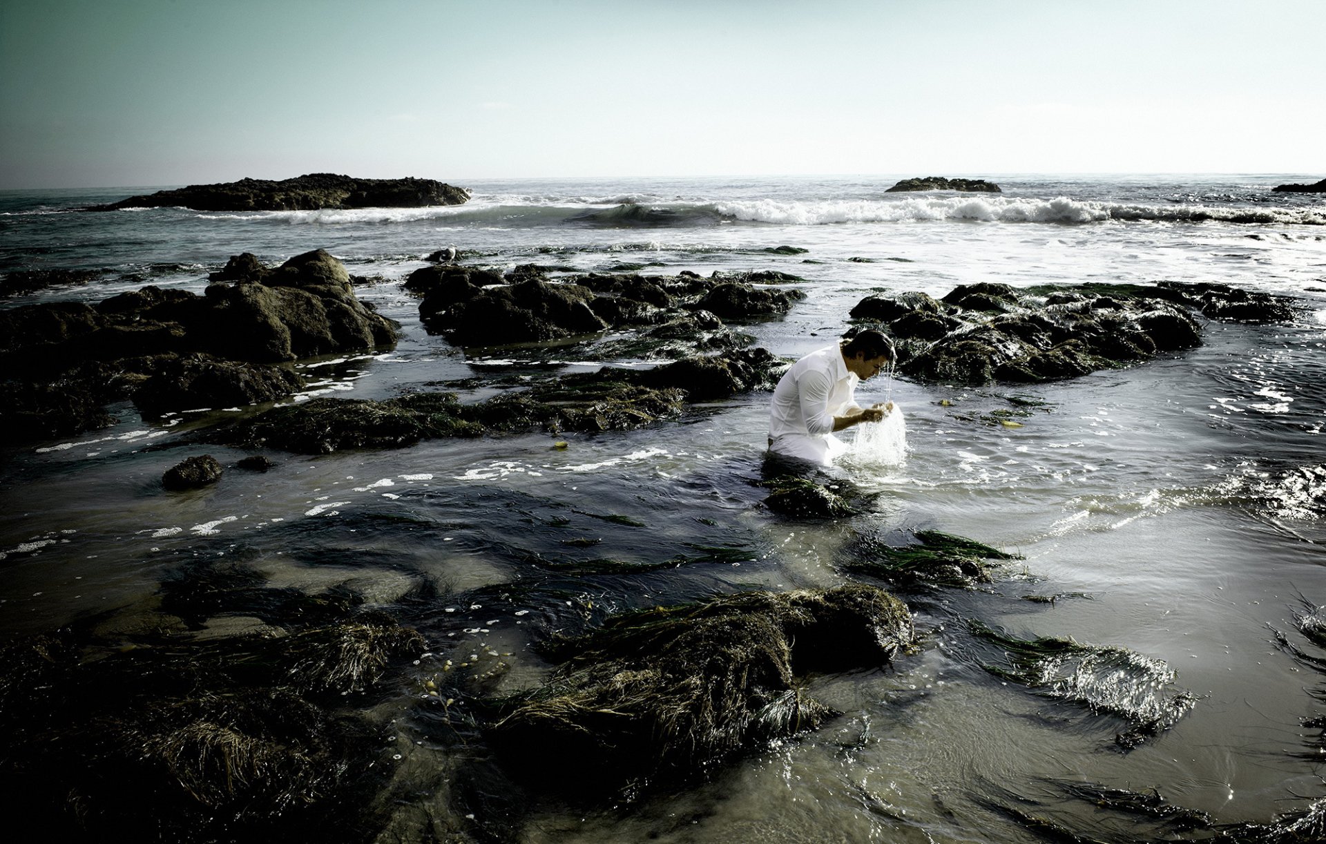 chris hemsworth actor wet white dress lapped in water sea beach waves photos yu tsai magazine flaunt