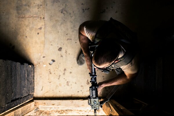 An armed soldier at a combat post