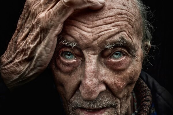 An elderly man with blue eyes