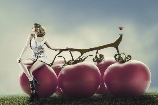 Creative photo of a girl on tomatoes