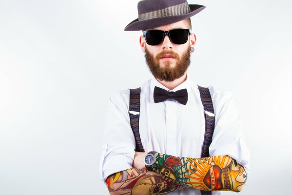 Classic style of a man with a tattoo on his hands