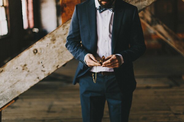 A man in a parade with a watch but without a face