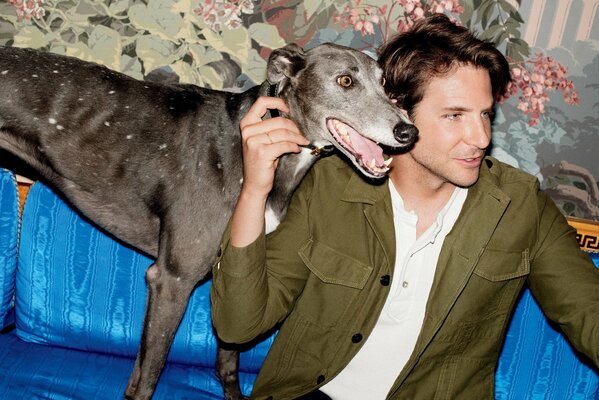 Bradley Cooper hugs a dog