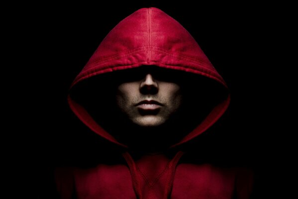 A man in a red jacket with a hood