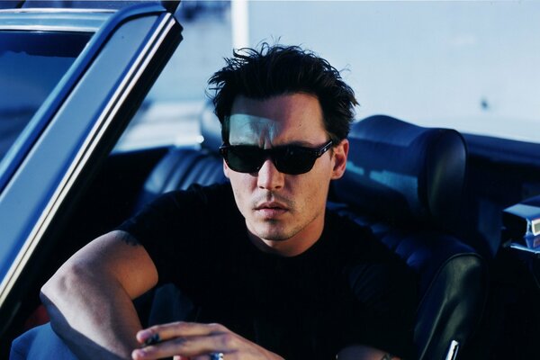 Johnny Depp in sunglasses at the wheel