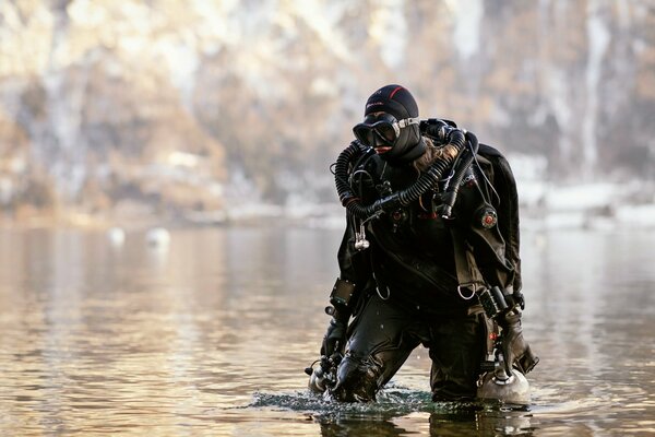 The diver comes out of the lake