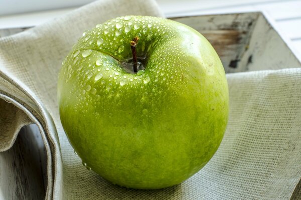 Washed green apple, fruit in water