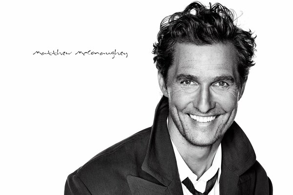 Smiling Matthew McConaughey on a white background