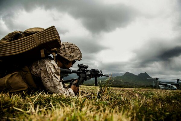 The soldier aims at the plane