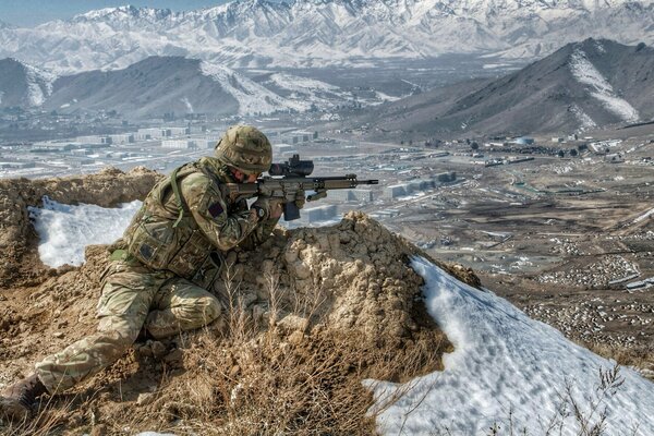 A soldier serving in the army in the mountains