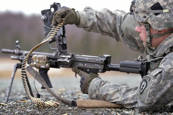 A soldier with a gun. Reloading weapons