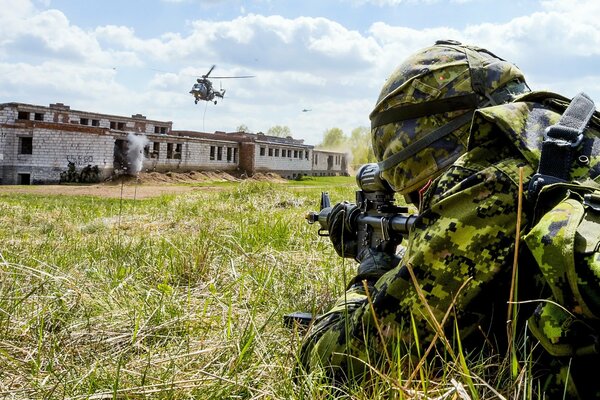 The soldier is waiting for the command to launch an offensive