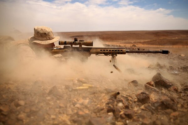 Sniper in fine sand dust