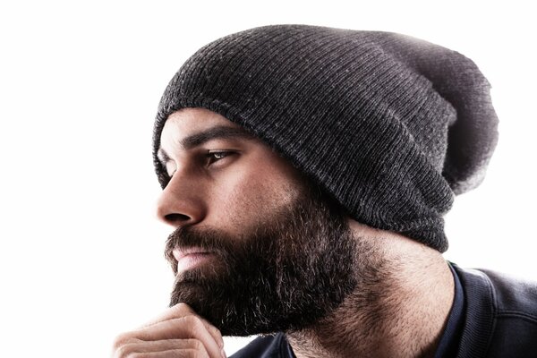 A guy with a beard in a hat