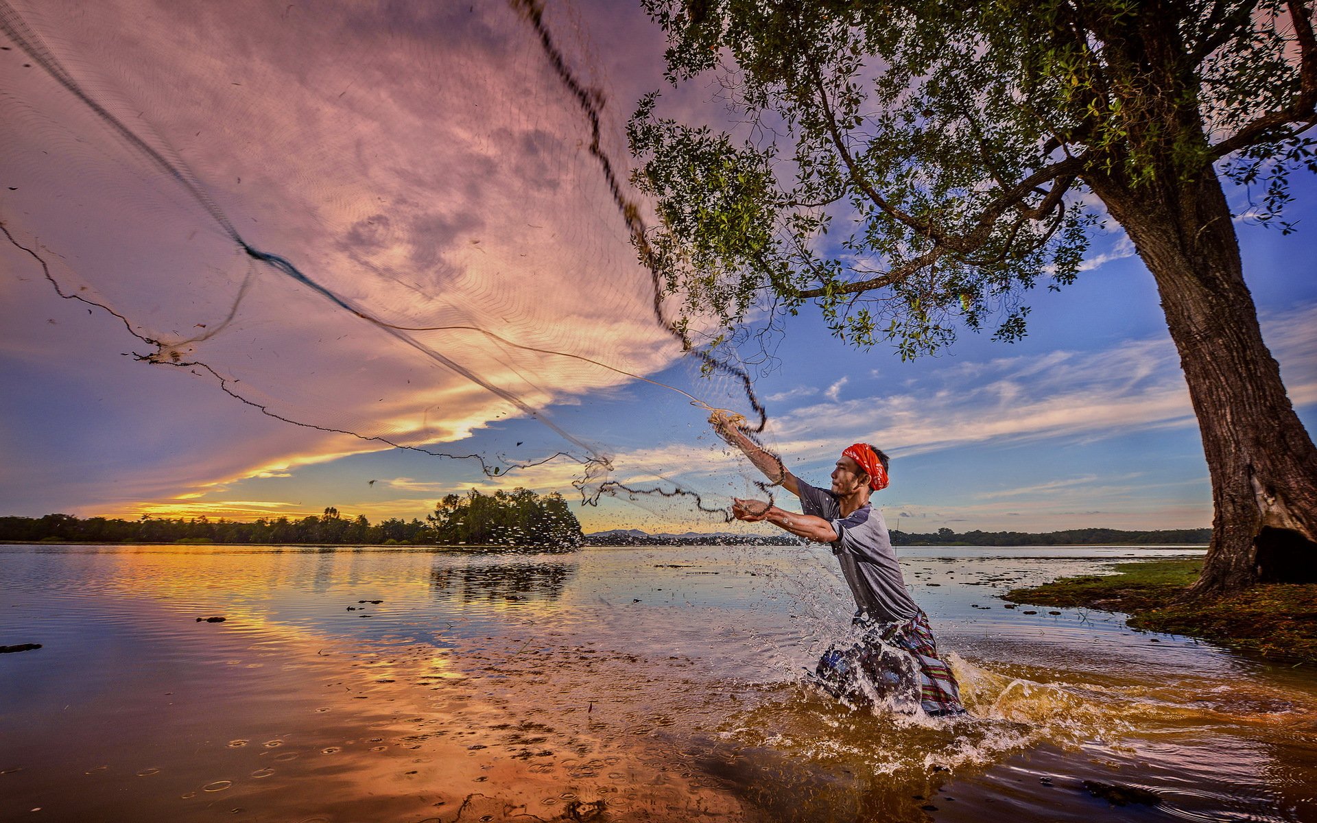 a fisherman network river sunset