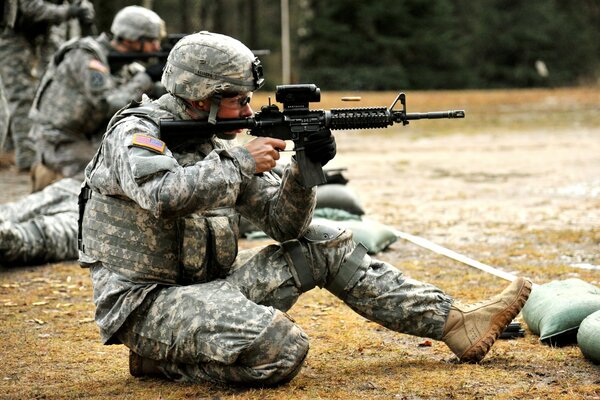 Shooting range. Soldier in equipment with weapons