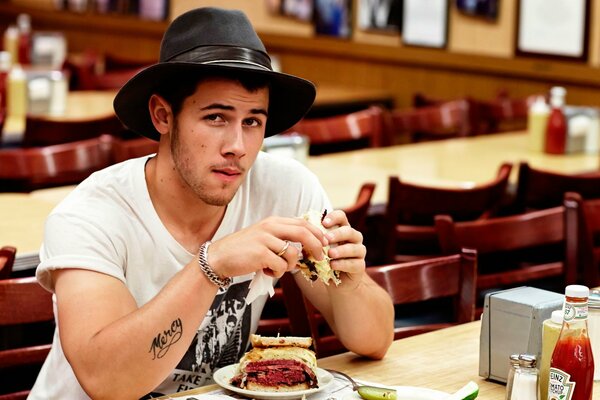 Nick jonas the singer in the hat