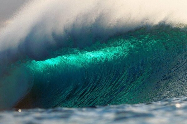 Beautiful ocean waves with a splash of plankton