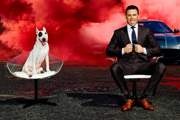 Actor channing tatum on a chair with a dog