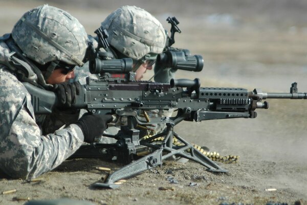 Soldiers in equipment with weapons