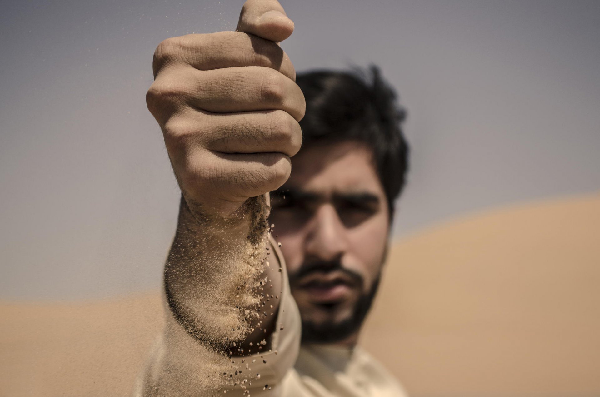 makro hand sand porträt