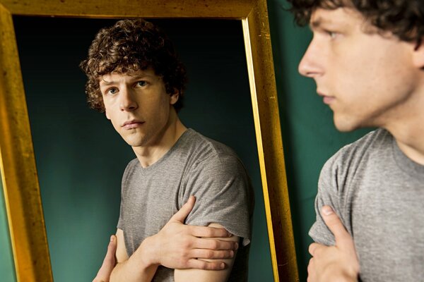 Reflection of Jesse Eisenberg in the mirror