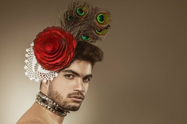 Guy posing with a peacock feather