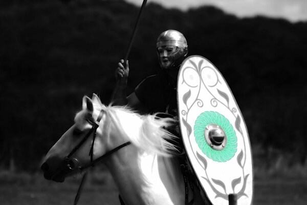 A warrior of the ancient Roman army on horseback