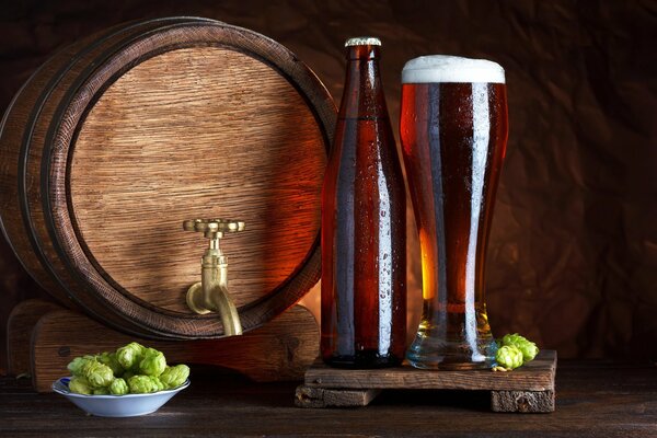 Still life barrel, beer bottle, hops