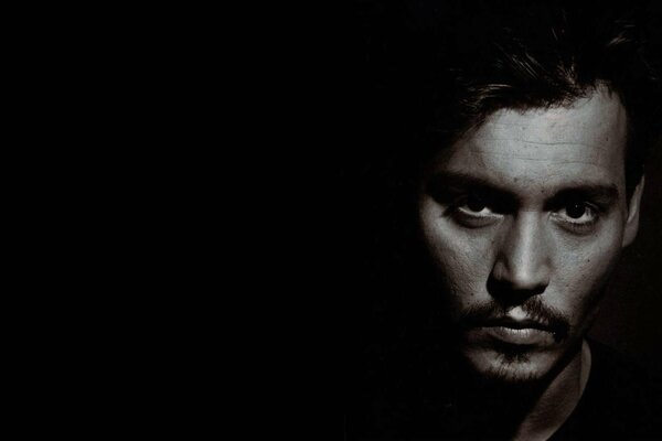 Johnny Depp s face photo on a black background