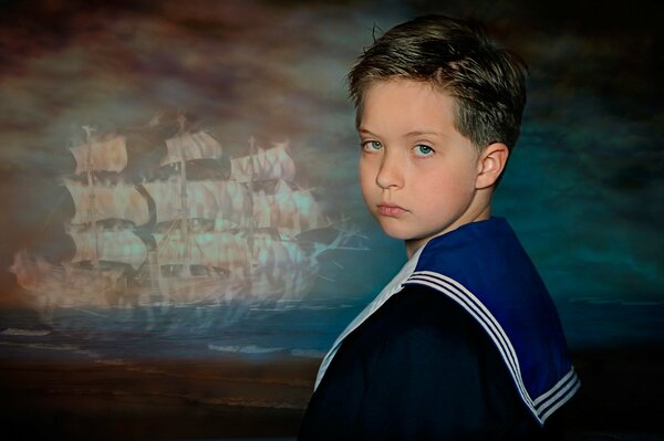 A young sailor on the background of the painting scarlet sails 