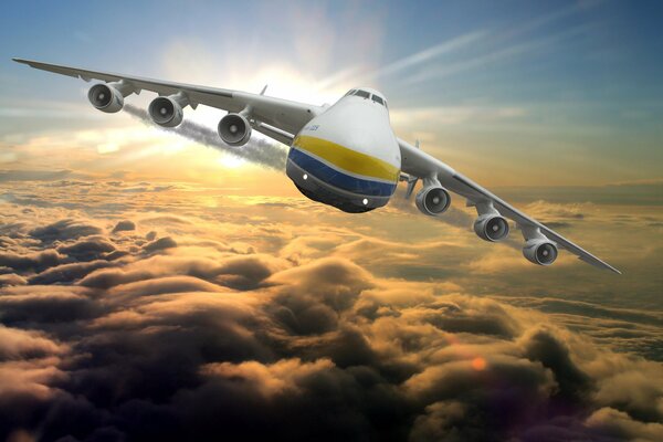 A large cargo plane is flying above the clouds