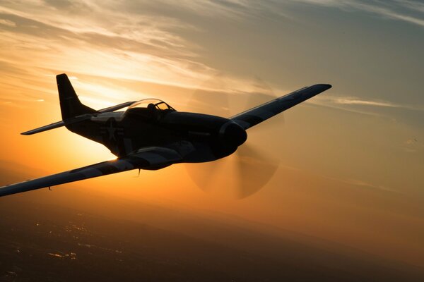 A small plane with a propeller in the sky