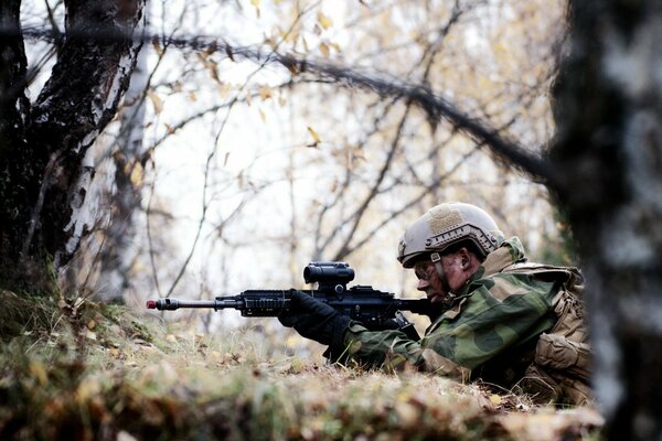 A Norwegian army soldier prepares to shoot