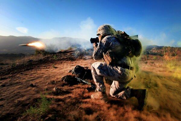 The soldier aims his weapon at the target