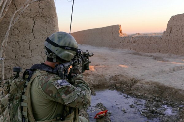 A special forces soldier aims at a target