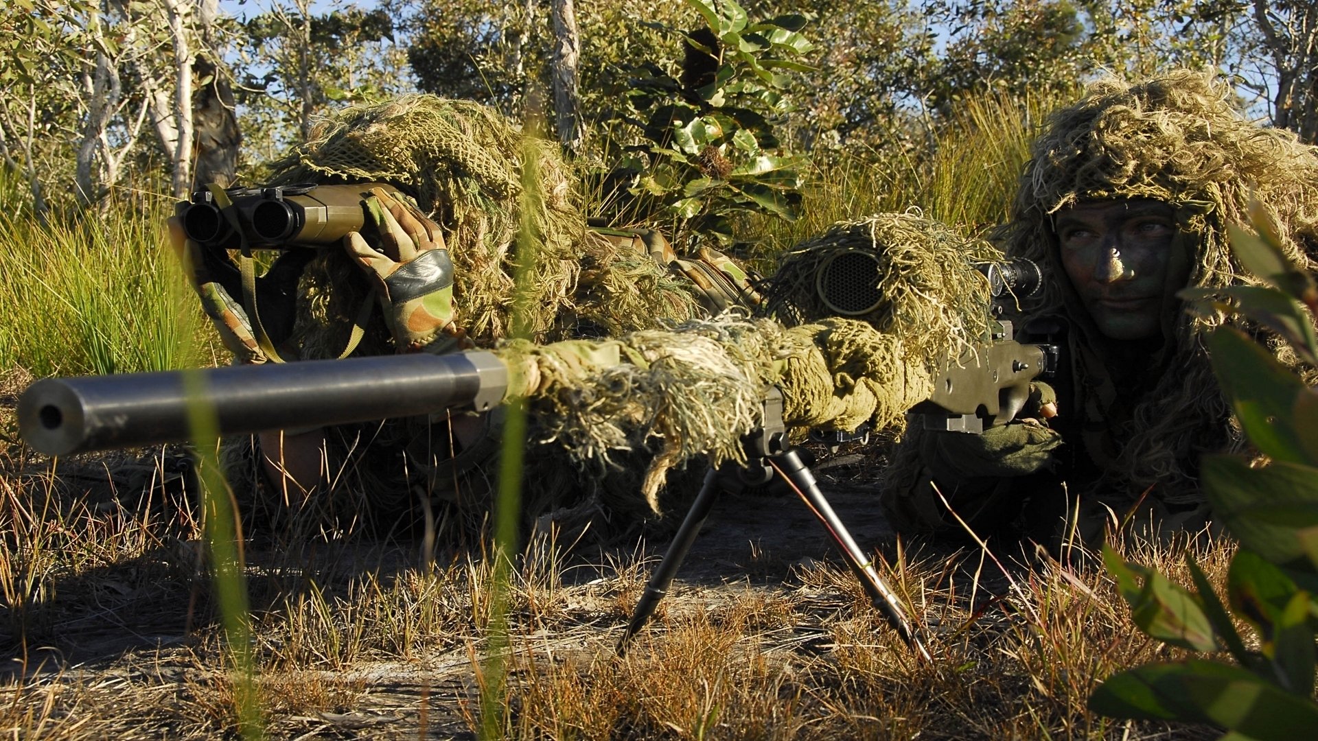 men sniper industrial complex camouflage firing position vegetation grass tree