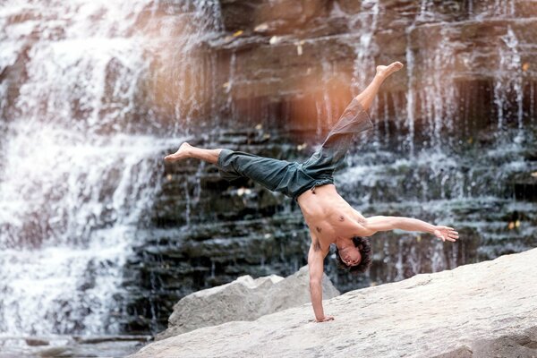 Michael Demsky dances at the waterfall