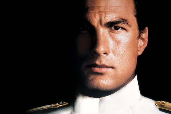 Steven Seagal in a navy jacket