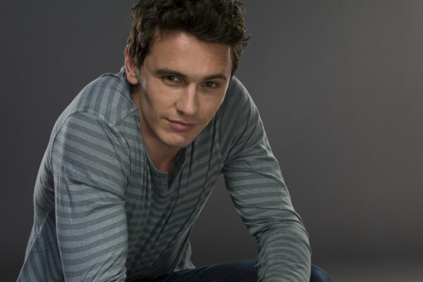 Photo on a gray background of actor James Franco