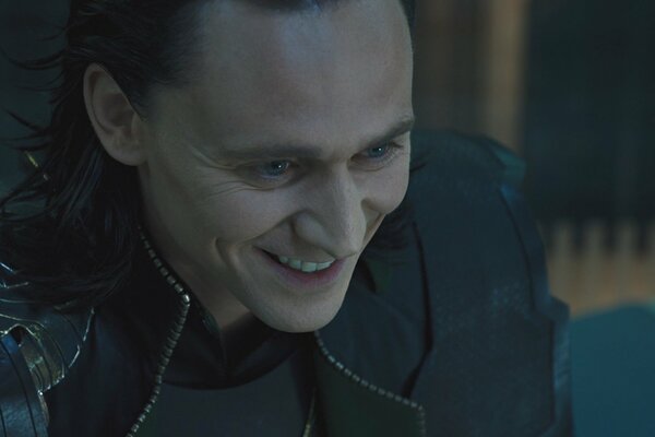 Actor Tom Hiddleston as Loki smiles